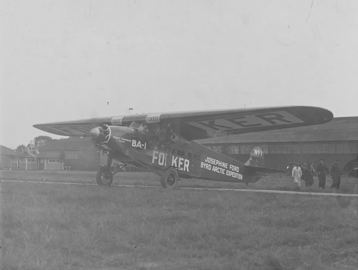 A three-engined high-wing monoplane with FOKKER and the name Josephine Ford painted on its fuselage, parked on open ground.