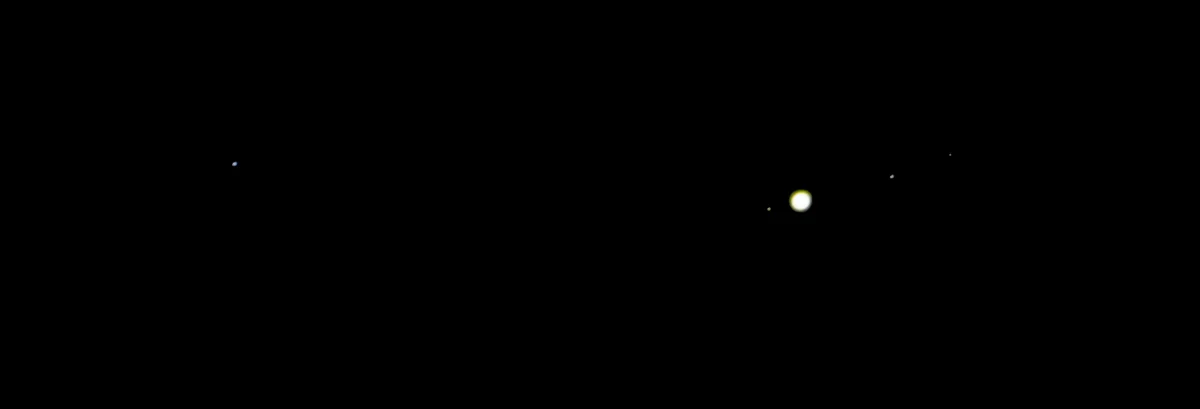 A night photograph from 10 April 2017: Jupiter as a bright dot with three of its moons in a line beside it, near the star theta Virginis in Virgo