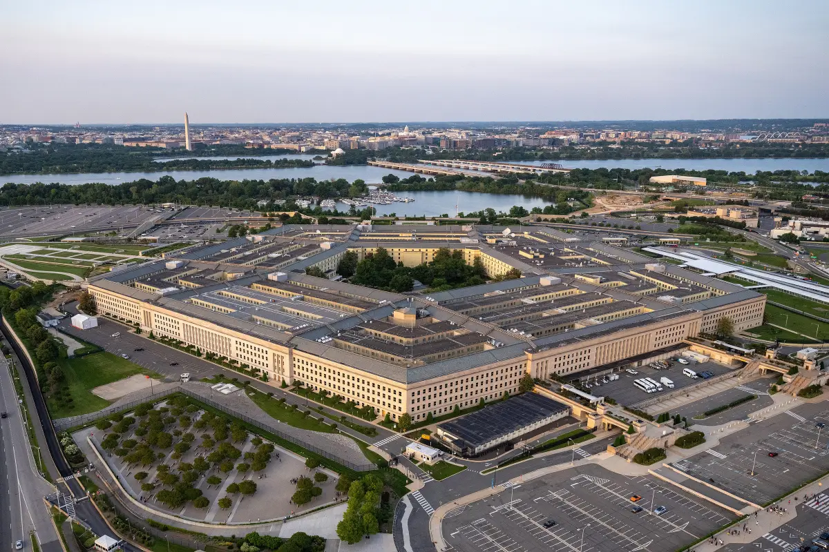 Aerial view of the five-sided Pentagon building in Arlington, Virginia, with its rings of offices and surrounding parking lots.