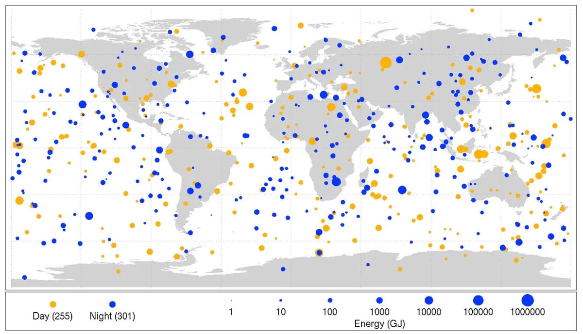A world map scattered with orange and yellow dots of different sizes marking fireballs, over oceans and land alike.