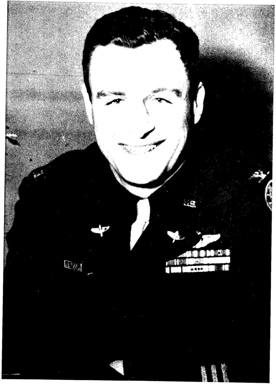 Portrait of Colonel William Blanchard in uniform, smiling, with pilot's wings and ribbons.