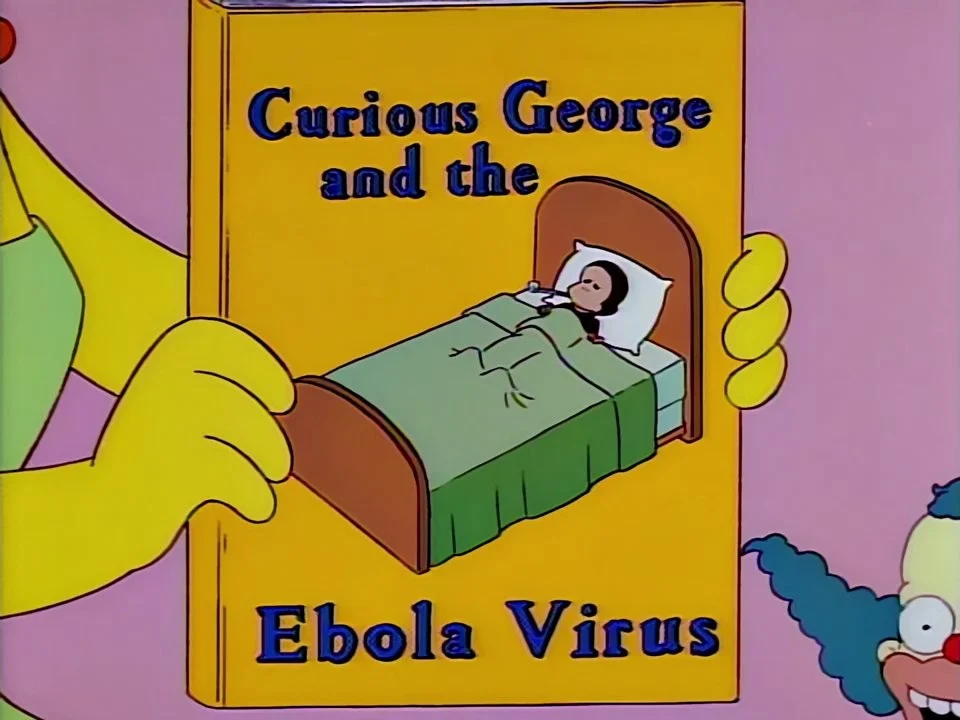 Hands holding up a yellow book titled Curious George and the Ebola Virus, a small monkey ill in bed on its cover.