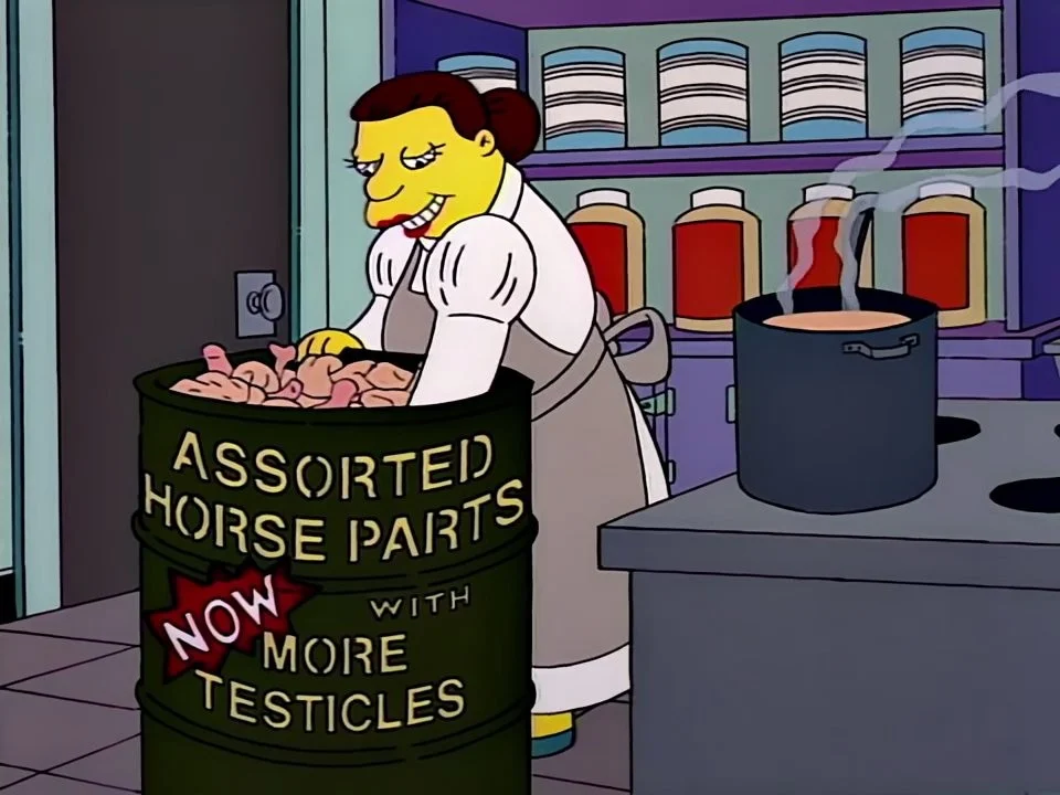 A smiling lunch lady reaching into a green drum labelled Assorted Horse Parts, Now With More Testicles.