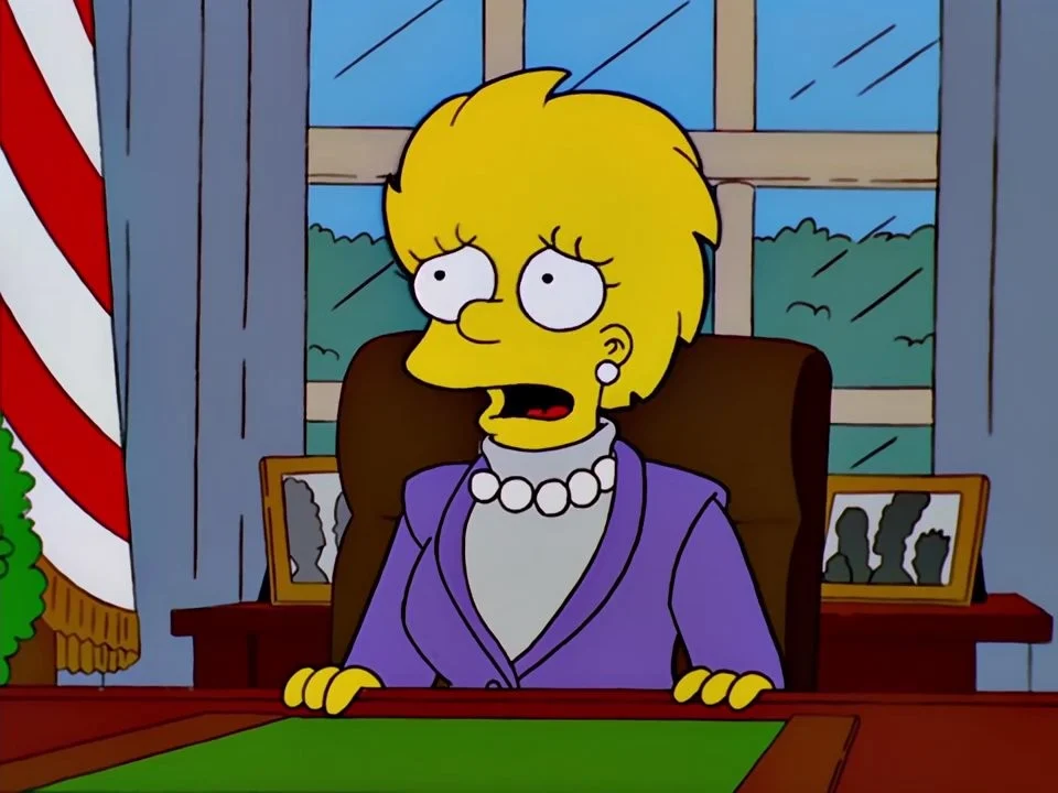 Close view of Lisa Simpson in a purple suit and pearl necklace.