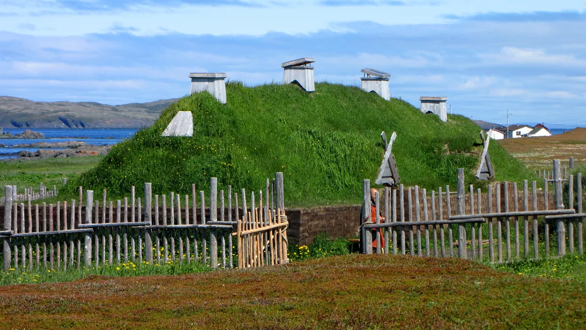 Reconstructed Norse sod longhouses with grass roofs at L'Anse aux Meadows, Newfoundland.