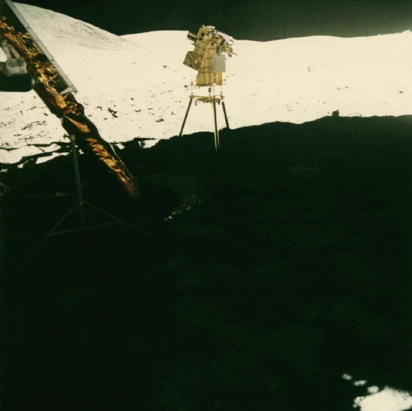 Apollo 16 ultraviolet astronomical camera standing in the lunar module shadow.